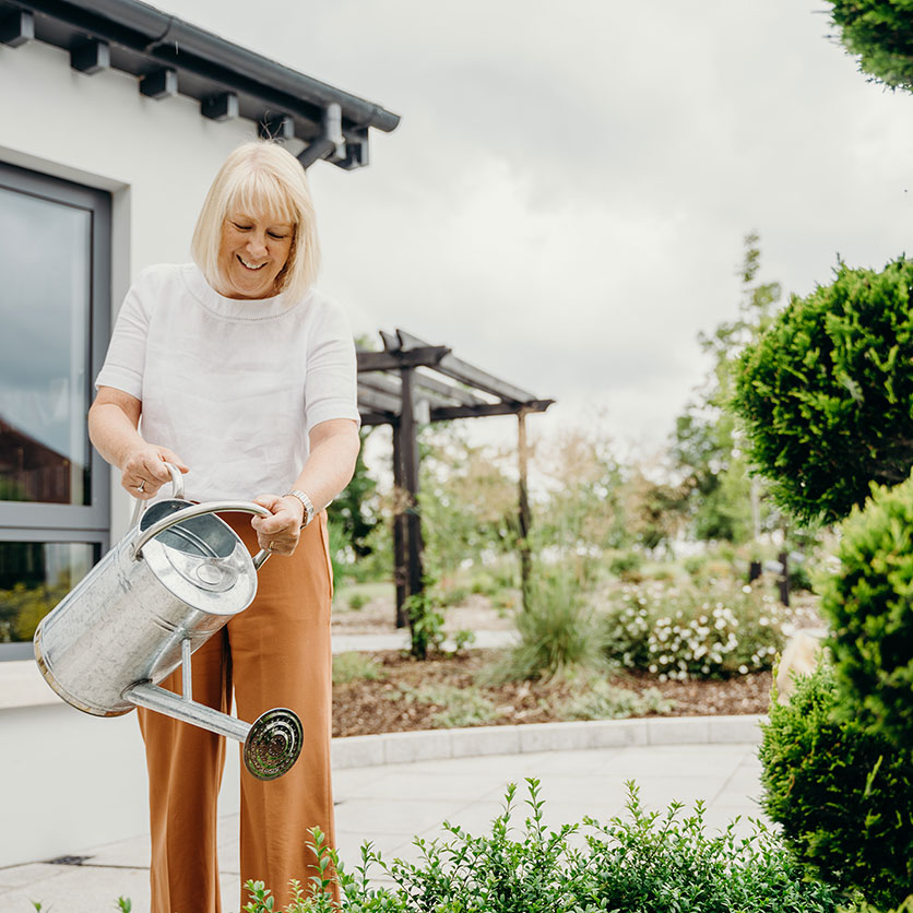 Woman-Watering-Plants-(1).jpg